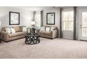 Living room with beige couches, coffee table, and window at 1075 Oak Meadow Dr., Conway, SC 29526