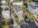 Aerial view of two-story home and surrounding houses at 124 Rainbow Dr., Murrells Inlet, SC 29576