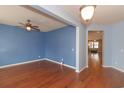 Light-filled dining area with hardwood floors and blue walls at 1325 Cascarilla Ct., Myrtle Beach, SC 29579