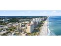 Wide shot of the coastline, high-rise buildings, and beach at 2000 N Ocean Blvd. # 301, Myrtle Beach, SC 29577