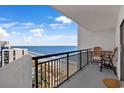 Balcony with ocean views and seating for two at 2001 S Ocean Blvd. # 1401, Myrtle Beach, SC 29577