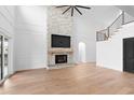 Living room with hardwood floors, fireplace, and high ceilings at 215 82Nd Ave. N, Myrtle Beach, SC 29572