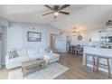 Open floor plan with a living room, dining area, and kitchen, creating a spacious and connected living space at 2268 Essex Dr. # L, Surfside Beach, SC 29575