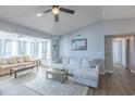 Inviting living room featuring hardwood floors, a ceiling fan, and two comfortable couches for ample seating at 2268 Essex Dr. # L, Surfside Beach, SC 29575