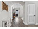 Inviting entryway showcasing pristine hardwood floors and arched doorway at 2450 Craven Dr., Myrtle Beach, SC 29579