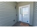 Front entry with door and welcome mat at 249 Moonglow Circle # 201, Murrells Inlet, SC 29576