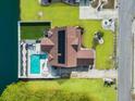 An aerial view of the home and its location highlighting the pool, backyard, solar panels, and pristine landscaping at 400 Dog Pen Ct., Myrtle Beach, SC 29579