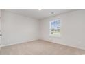 Simple bedroom with neutral walls, carpet, and a window with blinds at 4131 Robin Song Way, Loris, SC 29569