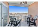 Relax on the balcony with comfortable chairs and tables, enjoying panoramic views of the marina at 4609 Lightkeepers Way # 11J, Little River, SC 29566