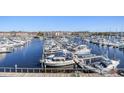 Expansive view of the marina showcasing numerous boats docked in the water at 4609 Lightkeepers Way # 11J, Little River, SC 29566