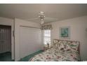Bright bedroom with double closet and floral bedding at 4625 Lightkeepers Way # L, Little River, SC 29566