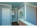 Condo entry with coat closet and wreath at 4625 Lightkeepers Way # L, Little River, SC 29566