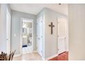 Hallway with hardwood floors, a bathroom and closets at 4629 Lightkeepers Way # 6-I, Little River, SC 29566