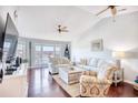 Spacious living room with hardwood floors, vaulted ceilings and water views at 4629 Lightkeepers Way # 6-I, Little River, SC 29566