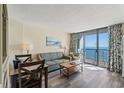 Living room with ocean view and sofa at 5308 N Ocean Blvd. # 1406, Myrtle Beach, SC 29577