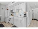 White kitchen featuring modern appliances and cabinetry at 5523 North Ocean Blvd. # 1402, Myrtle Beach, SC 29577