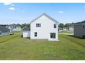 Two-story house with white siding, sliding glass doors, and backyard at 56 Cape Point Dr., Conway, SC 29527