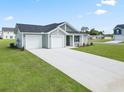 Newly built home with a two-car garage and spacious driveway at 57 Cape Point Dr., Conway, SC 29527