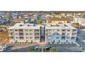 Aerial of building, showing its size and location within a neighborhood at 5709 N Ocean Blvd. # 303, North Myrtle Beach, SC 29582