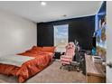 Cozy bedroom featuring a black accent wall, window and carpeted floor at 589 Talisman Trail, Longs, SC 29568