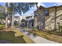 Exterior view showing the townhome's walkway, landscaping, and building architecture at 611 S 13Th Ave. # 175, Surfside Beach, SC 29575
