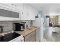 Condo kitchen with granite countertops and stainless steel appliances at 7000 N Ocean Blvd. # 326, Myrtle Beach, SC 29572