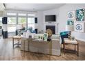 Bright living room with a fireplace and large windows at 711 Isle Verde Dr, Myrtle Beach, SC 29579
