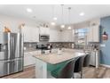 Modern kitchen with white cabinets, granite countertops, and stainless steel appliances at 719 Treaty Ct., Myrtle Beach, SC 29588