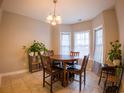 Bright dining area with a round table and chairs, plus large windows at 788 Rambler Ct., Myrtle Beach, SC 29588