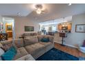 Cozy living room with plush sofa, open to the kitchen, creating a comfortable and inviting living space at 801 Benchmade Rd., Conway, SC 29527