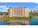Exterior view of condo building with balconies, surrounded by marsh and trees at 9547 Edgerton Dr. # 606, Myrtle Beach, SC 29572