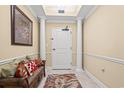 Elegant hallway with decorative columns, seating, and art at 9547 Edgerton Dr. # 606, Myrtle Beach, SC 29572