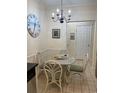 Dining area with glass table and four chairs at 9764 Leyland Dr. # 7, Myrtle Beach, SC 29572