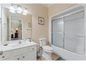 Clean bathroom with white vanity, toilet, and shower at 118 Seabreeze Dr., Murrells Inlet, SC 29576