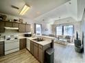 Open kitchen with light wood cabinets and modern appliances at 1310 River Oaks Dr. # 2K, Myrtle Beach, SC 29579