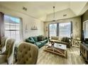 Spacious living area with teal sofas and coastal decor at 1310 River Oaks Dr. # 2K, Myrtle Beach, SC 29579