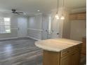 Modern kitchen featuring a large island and light wood cabinets at 1742 John St., Conway, SC 29527