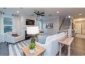 Living room with fireplace, comfortable seating, and a view of the staircase at 1757 Tryon Dr, Myrtle Beach, SC 29588