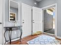 Bright foyer features gleaming wood floors, a decorative console table and access to the home's exterior at 185 Sebring Ln., Myrtle Beach, SC 29588