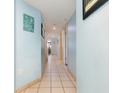 Light blue hallway with tile floors and beach decor at 205 74Th Ave. N # 1603, Myrtle Beach, SC 29572