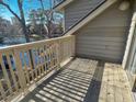 Private deck with wooden railing, overlooking a scenic lake and lush landscape at 211 Baslow Ct. # 2-D, Myrtle Beach, SC 29572