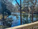 Peaceful water view from a deck overlooking a tranquil lake and surrounding trees at 211 Baslow Ct. # 2-D, Myrtle Beach, SC 29572