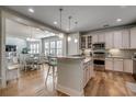 Spacious kitchen with an island, stainless steel appliances, and hardwood floors at 404 Banyan Place, North Myrtle Beach, SC 29582