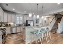 Eat-in kitchen with island seating and stainless steel appliances at 404 Banyan Place, North Myrtle Beach, SC 29582
