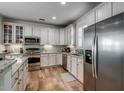 Modern kitchen with stainless steel appliances and light-colored cabinets at 404 Banyan Place, North Myrtle Beach, SC 29582