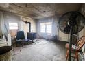 Unfinished living room with wood stove and exposed walls at 4151 Maple St., Loris, SC 29569