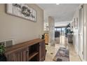 Welcoming condo entryway transitions into a spacious living area offering serene outdoor views of the boats at 4390 Bimini Ct. # 206-C, Little River, SC 29566