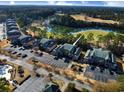 Condo building with parking and pool access at 478 Pinehurst Ln. # 17F, Pawleys Island, SC 29585