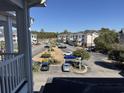 Aerial view of condo community parking lot with cars at 4860 Carnation Circle # 304, Myrtle Beach, SC 29579