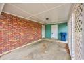 Covered carport with brick and teal exterior walls at 534 Juniper Dr. # 534, Myrtle Beach, SC 29577